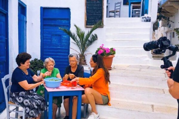 despoina vandi strilling beans together with the women of tinos island