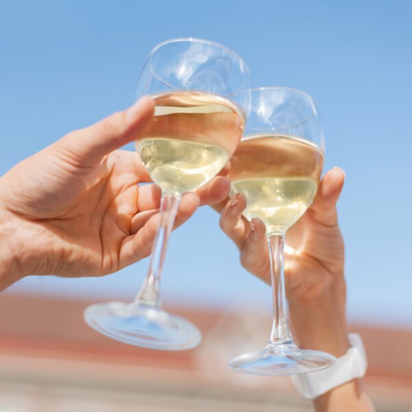 toasting glasses with white wine