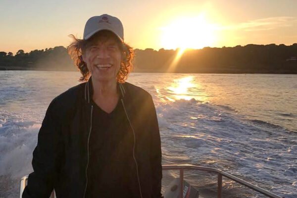 mick jagger in a speedboat in greece